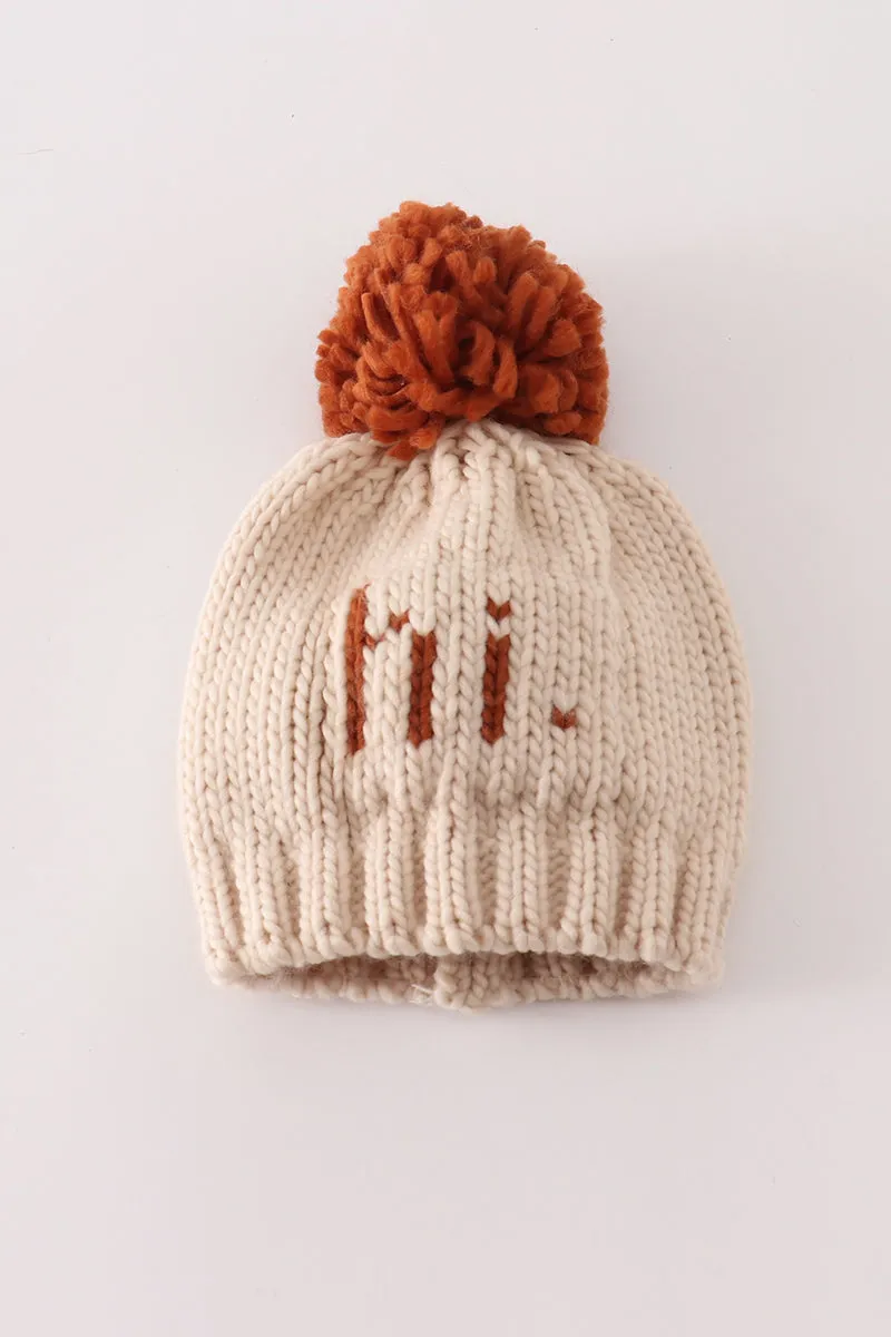 Beige pompom hi cable beanie