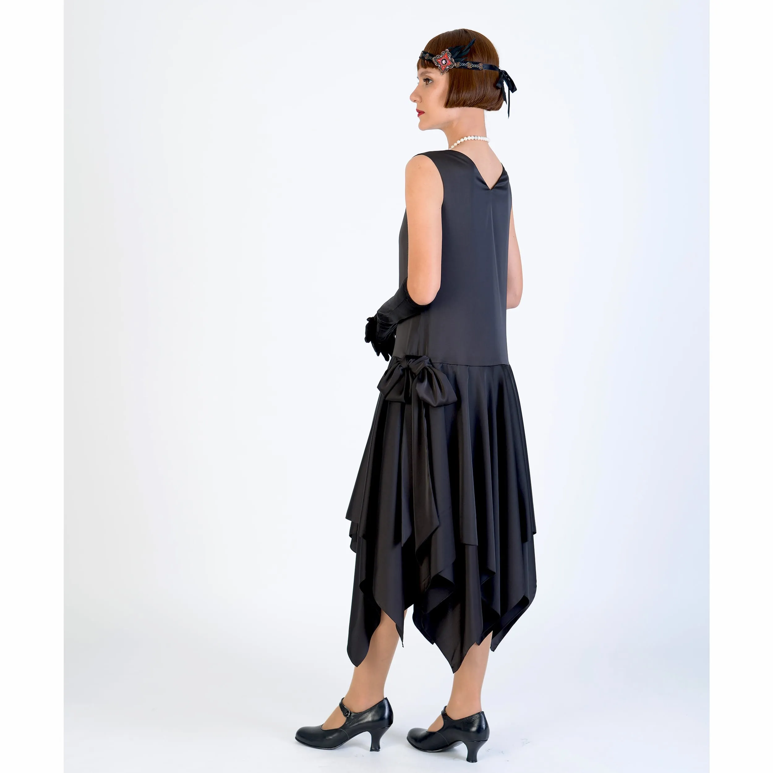 Black 1920s evening dress of satin with handkerchief skirt