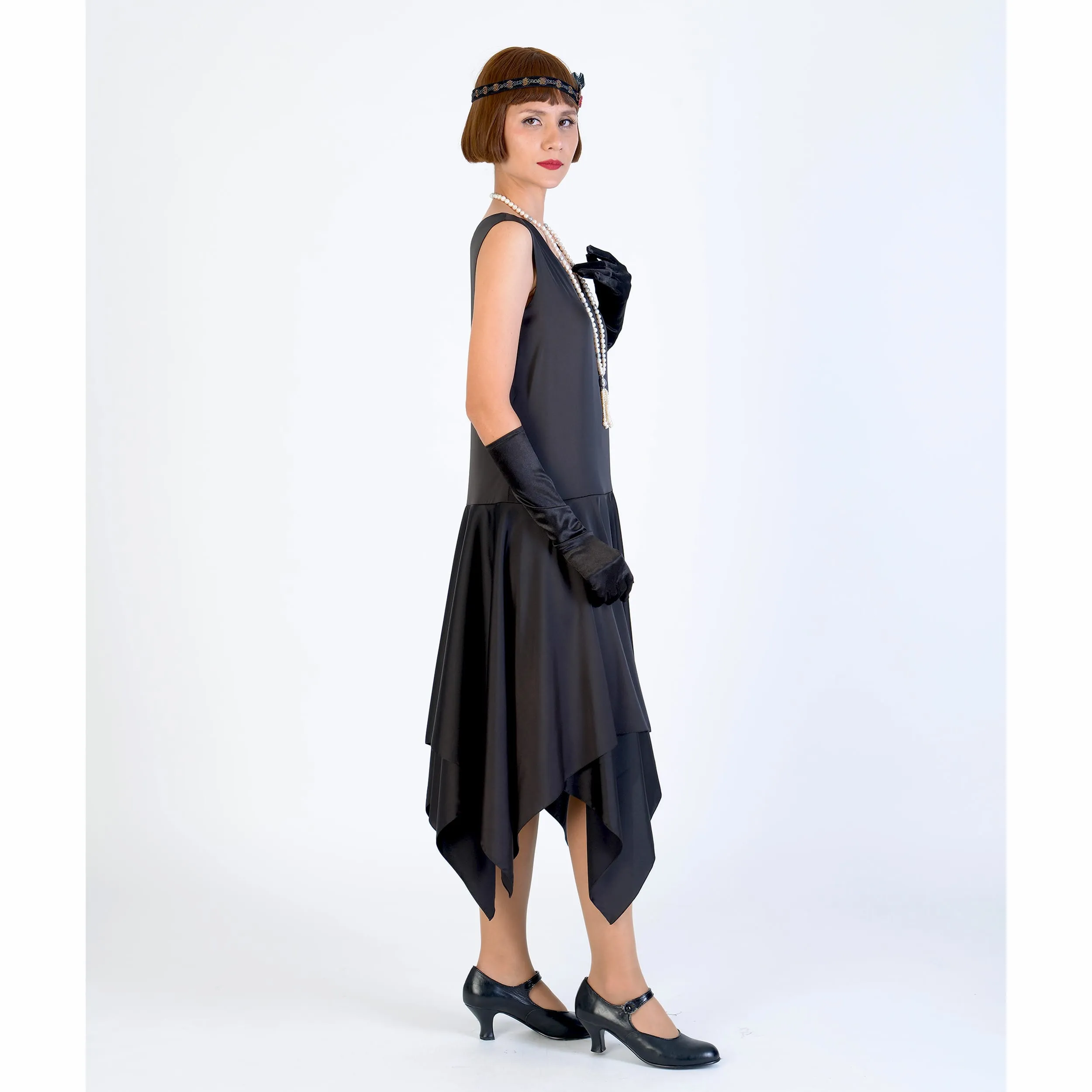 Black 1920s evening dress of satin with handkerchief skirt