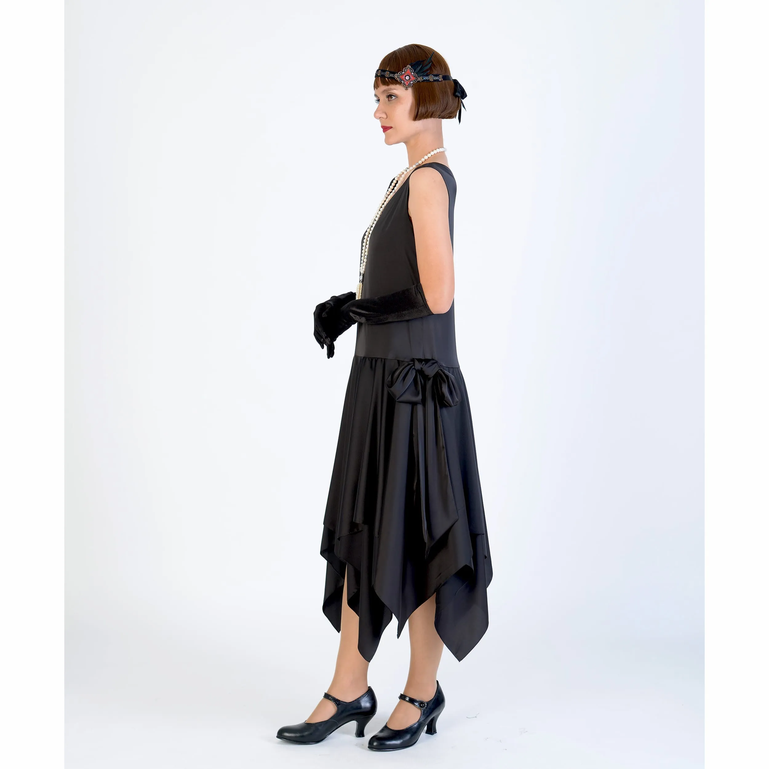 Black 1920s evening dress of satin with handkerchief skirt