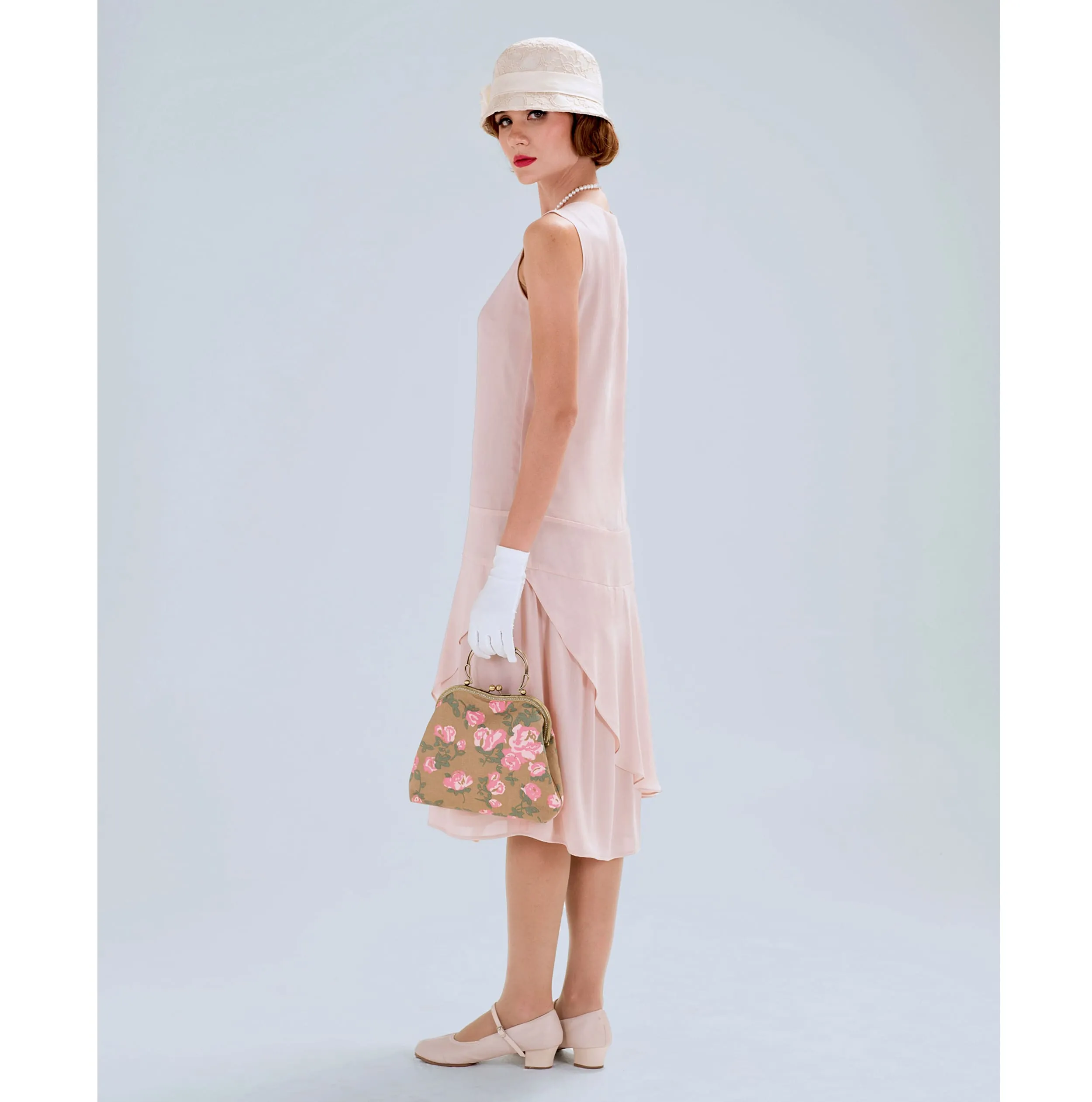 Nude jazz age chiffon flapper dress with a ruffled skirt detail