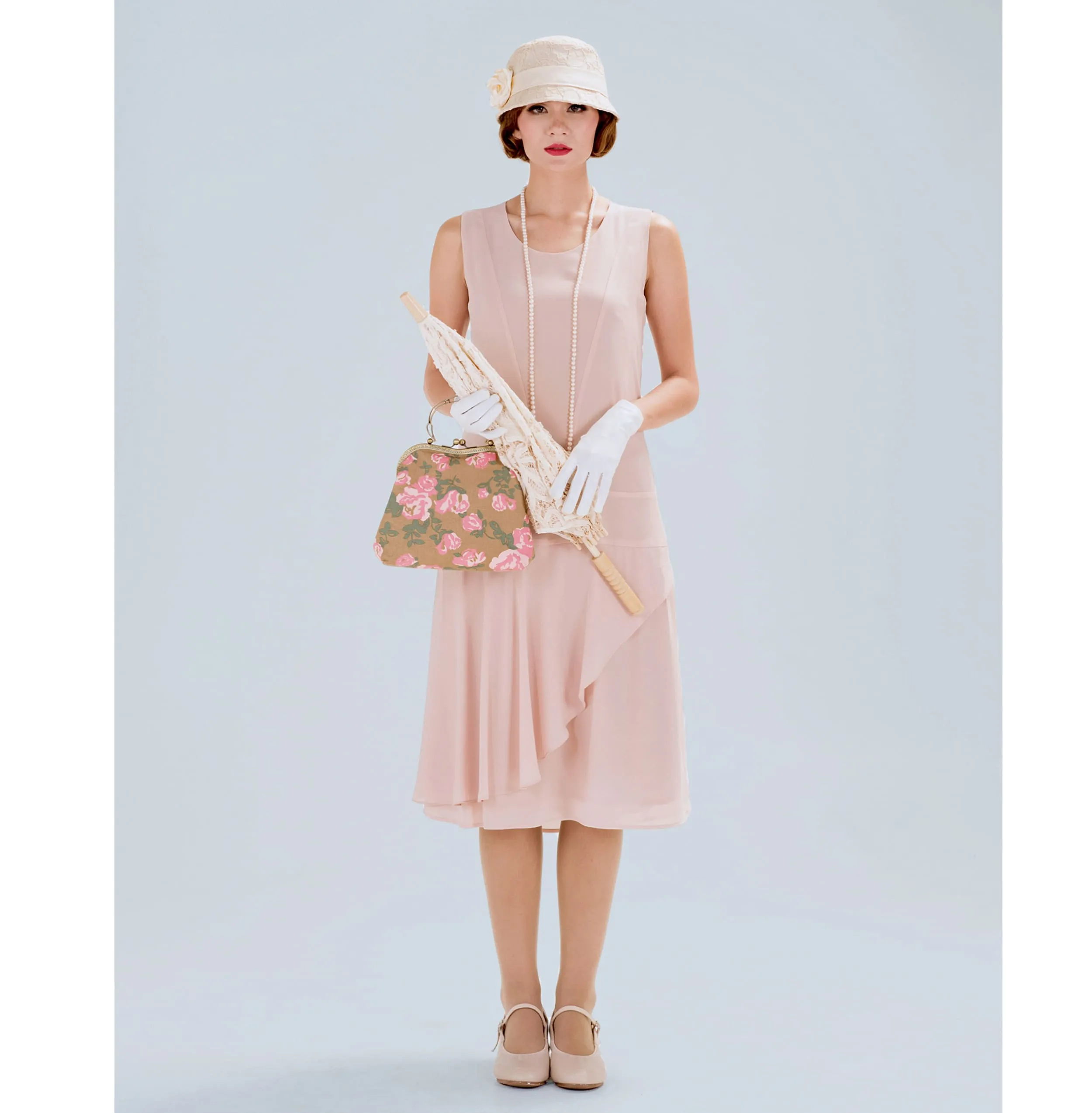 Nude jazz age chiffon flapper dress with a ruffled skirt detail